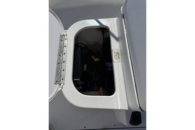 Slide: The Image of Open hatch of 2016 Sportsman Island Bay 20 boat showing internal compartment. - 24
