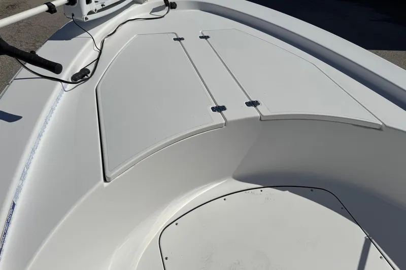 Slide: The Image of 2016 Sportsman Island Bay 20 boat deck with storage compartments. - 26