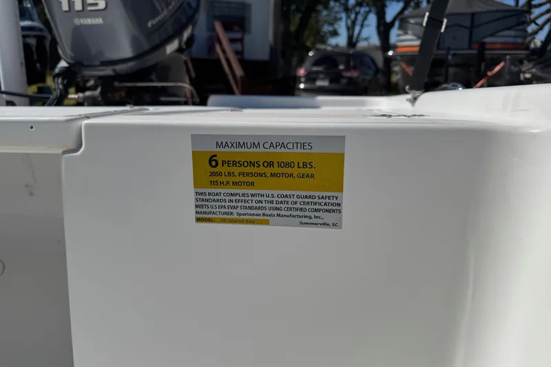 Slide: The Image of 2016 Sportsman Island Bay 20 capacity label, 6 persons or 1080 lbs, 115 HP motor. - 29
