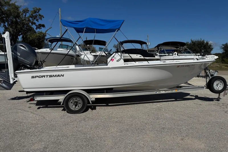 Slide: The Image of 2016 Sportsman Island Bay 20 boat on trailer with blue canopy. - 5