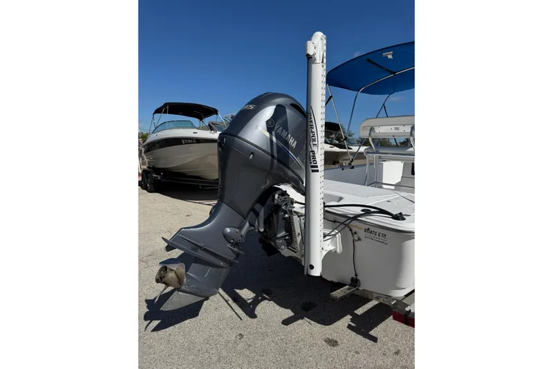 Slide: The Image of 2016 Sportsman Island Bay 20 boat with Yamaha outboard motor, parked on a sunny day. - 8