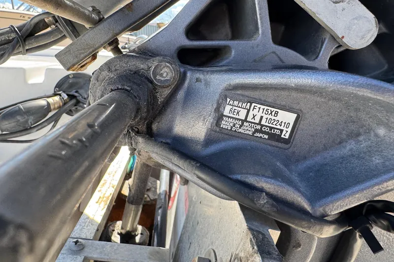 Slide: The Image of Close-up of a Yamaha motor part on a 2016 Sportsman Island Bay 20 boat. - 9