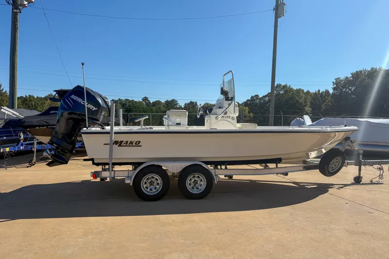 The Image of 2017 Mako 21 LTS boat on trailer with Mercury outboard motor. - 1