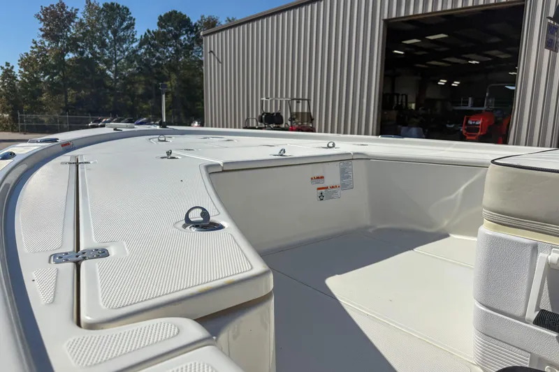 Slide: The Image of 2017 Mako 21 LTS boat interior with seating and storage compartments. - 10