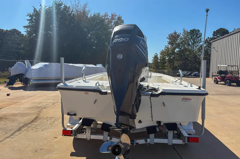Slide: The Image of 2017 Mako 21 LTS boat with powerful outboard motor on trailer. - 4