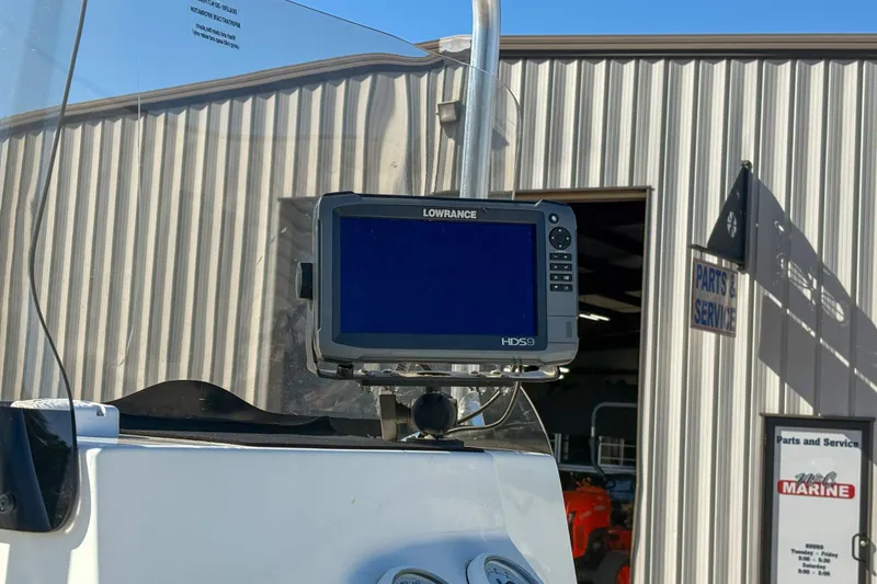 Slide: The Image of Lowrance HDS9 fishfinder on 2017 Mako 21 LTS boat near service building. - 7