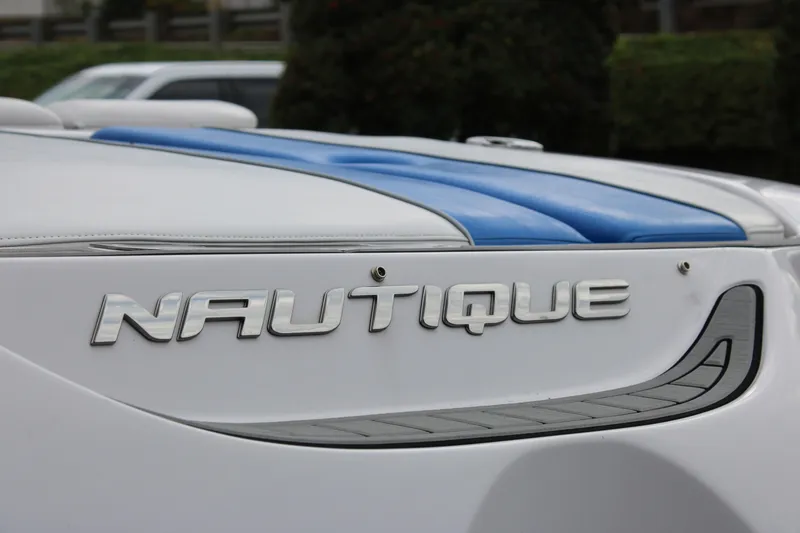 Slide: The Image of 2010 Correct Craft AIR NAUTIQUE SV 211 boat, close-up of logo and design details. - 6