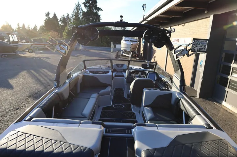 Slide: The Image of 2022 Tigé Z3 boat interior with sleek seating and advanced dashboard features. - 11