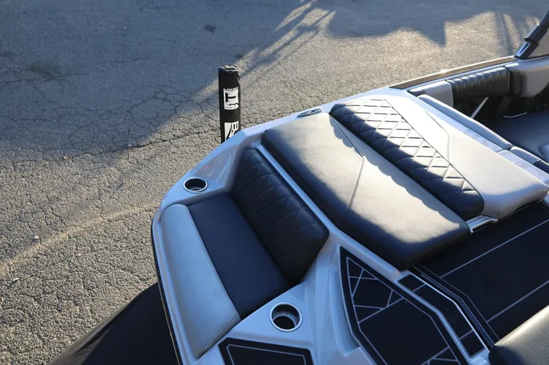 Slide: The Image of 2022 Tigé Z3 boat interior with black and gray cushioned seating. - 12