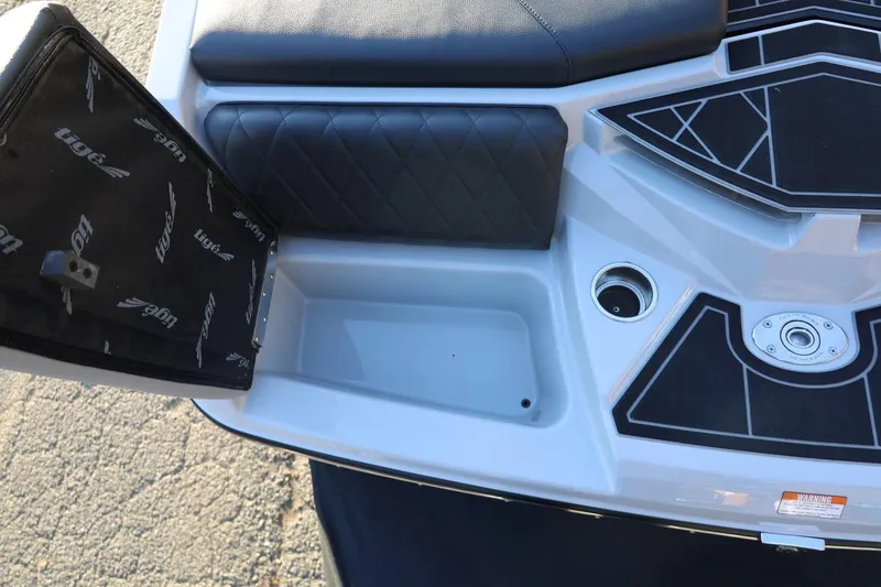 Slide: The Image of 2022 Tigé Z3 boat interior with black seating and storage compartment. - 14