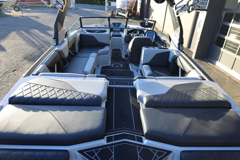 Slide: The Image of 2022 Tigé Z3 boat interior with luxurious seating and modern design. - 16