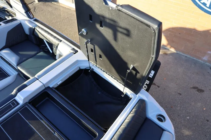 Slide: The Image of 2022 Tigé Z3 boat interior with open storage compartment and seating. - 19