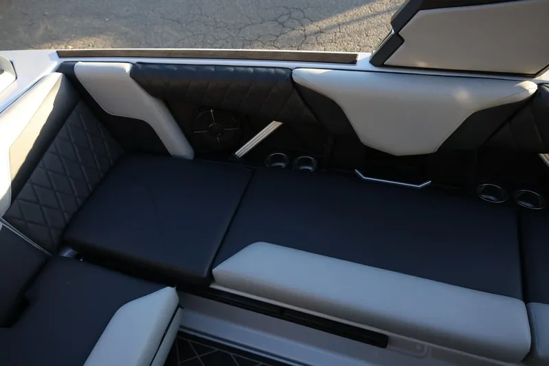 Slide: The Image of 2022 Tigé Z3 boat interior with black and white cushioned seating. - 24