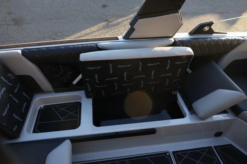 Slide: The Image of 2022 Tigé Z3 boat interior with open storage compartment and stylish seating. - 25