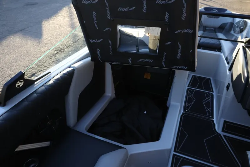 Slide: The Image of 2022 Tigé Z3 boat interior with open storage compartment and stylish seating. - 27