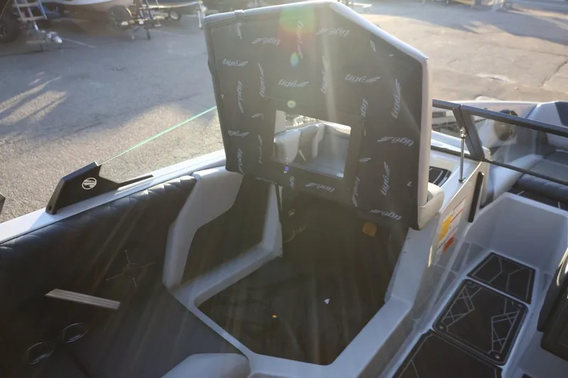 Slide: The Image of 2022 Tigé Z3 boat interior with sunlit seating and branded upholstery. - 28