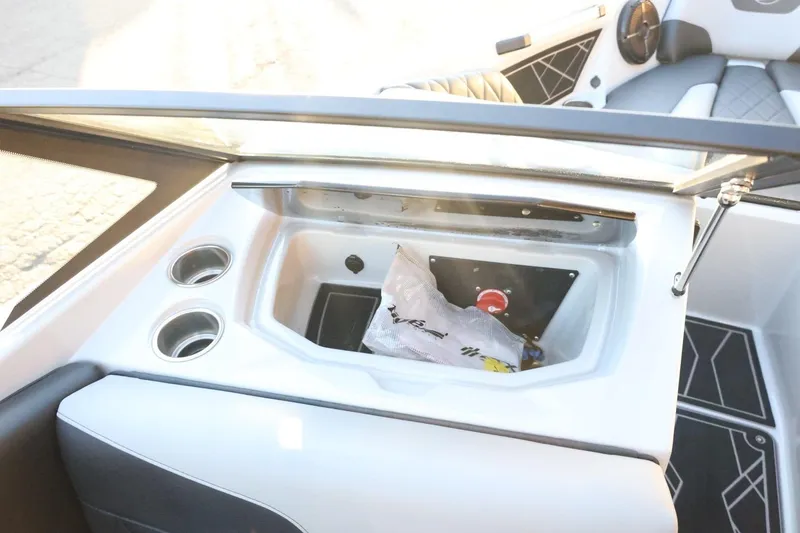 Slide: The Image of 2022 Tigé Z3 boat interior with storage compartment and cup holders. - 43
