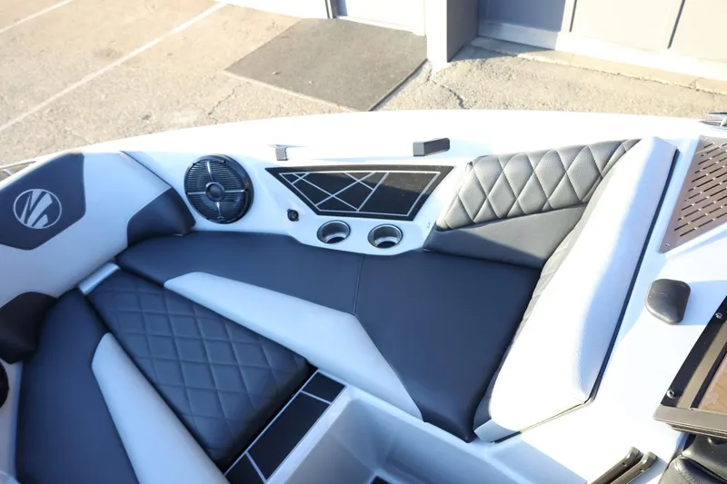 Slide: The Image of 2022 Tigé Z3 boat interior with black and white cushioned seating and speaker system. - 45
