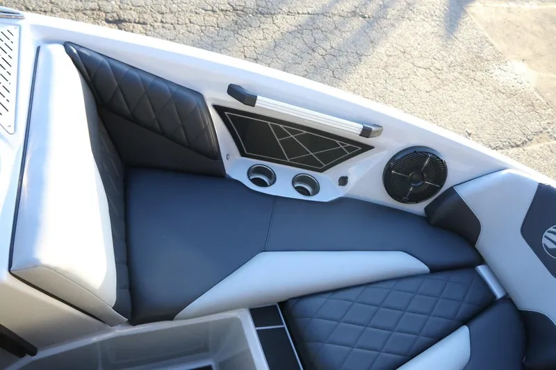 Slide: The Image of 2022 Tigé Z3 boat interior with black and white cushioned seating and speaker system. - 46