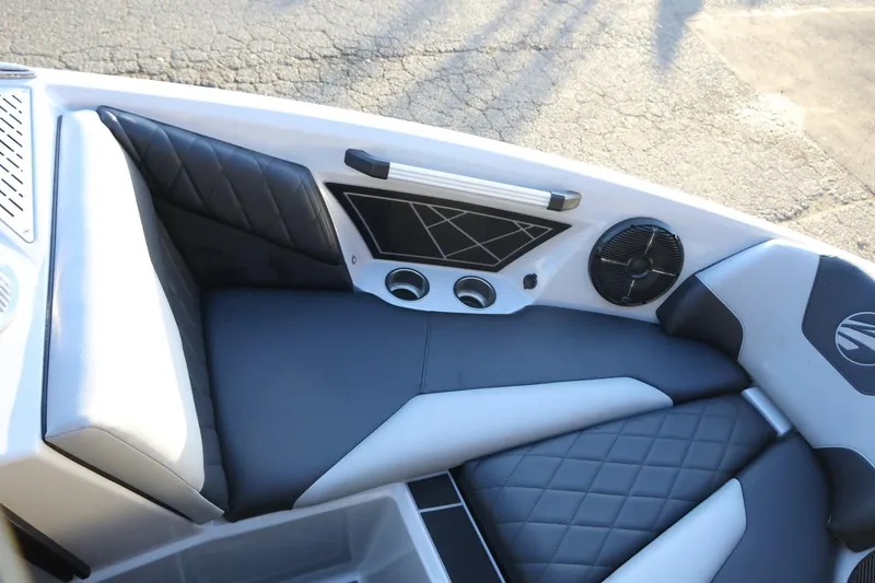 Slide: The Image of 2022 Tigé Z3 boat interior with black and gray cushioned seating. - 48