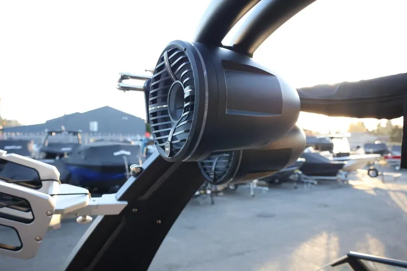 Slide: The Image of 2022 Tigé Z3 boat speaker system in a marina setting at sunset. - 54