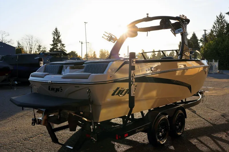 Slide: The Image of 2022 Tigé Z3 boat on trailer at sunset, showcasing sleek design and modern features. - 6