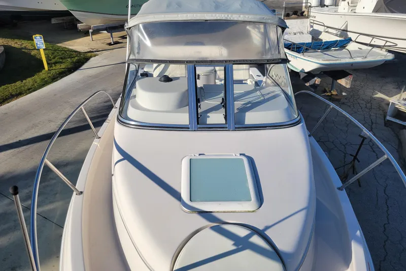 Slide: The Image of 2008 Cobia 236 Walk Around boat with windshield and deck view. - 5