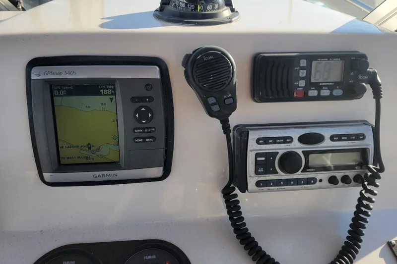 Slide: The Image of Control panel of a 2008 Cobia 236 Walk Around boat with Garmin GPS and radio equipment. - 9