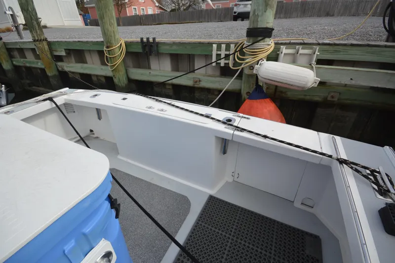 Slide: The Image of 2008 Wayne Beal EXPRESS boat docked, showing deck and mooring setup. - 16