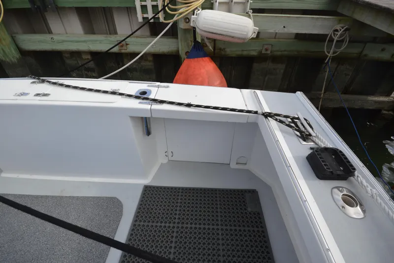 Slide: The Image of 2008 Wayne Beal EXPRESS boat deck with ropes and dock fender. - 17