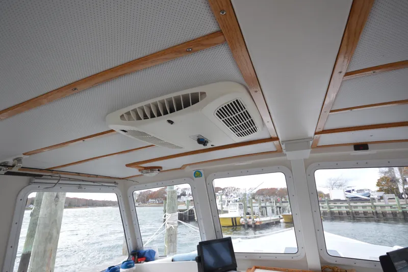 Slide: The Image of Interior view of 2008 Wayne Beal EXPRESS boat with wooden ceiling accents and windows. - 24