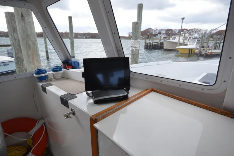 Slide: The Image of Interior view of 2008 Wayne Beal EXPRESS boat with dockside scenery. - 25