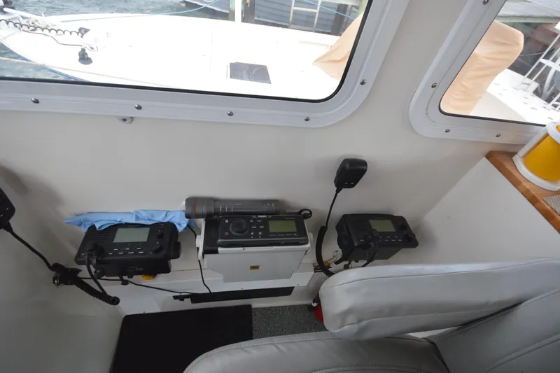 Slide: The Image of Interior of a 2008 Wayne Beal EXPRESS boat with communication equipment and seating. - 30