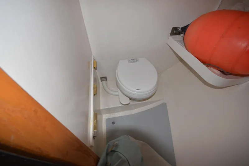 Slide: The Image of Compact marine bathroom with toilet and orange buoy, Wayne Beal EXPRESS 2008. - 34