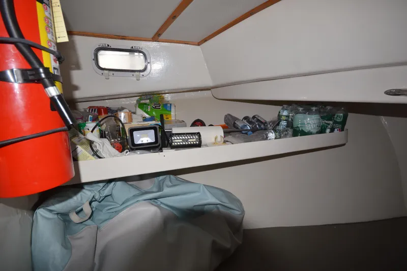 Slide: The Image of Interior of 2008 Wayne Beal EXPRESS boat with storage shelf and fire extinguisher. - 35