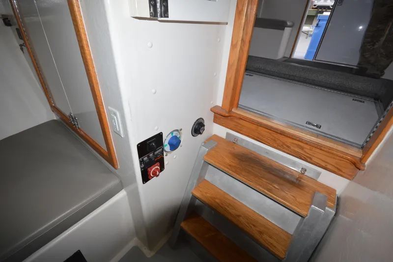 Slide: The Image of Interior of 2008 Wayne Beal EXPRESS boat with wooden steps and control panel. - 36