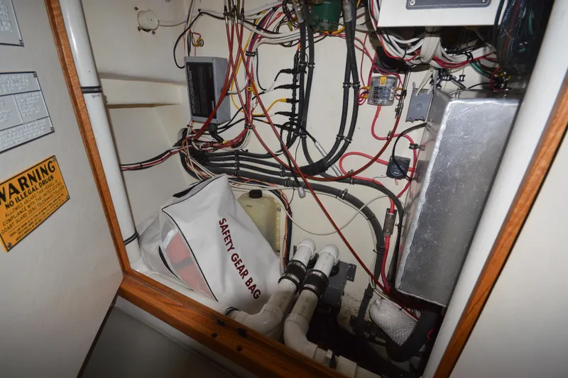 Slide: The Image of Engine room of 2008 Wayne Beal EXPRESS boat with safety gear bag and wiring. - 39