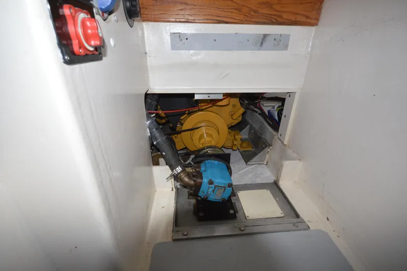 Slide: The Image of Engine compartment of a 2008 Wayne Beal EXPRESS boat, featuring mechanical components. - 41