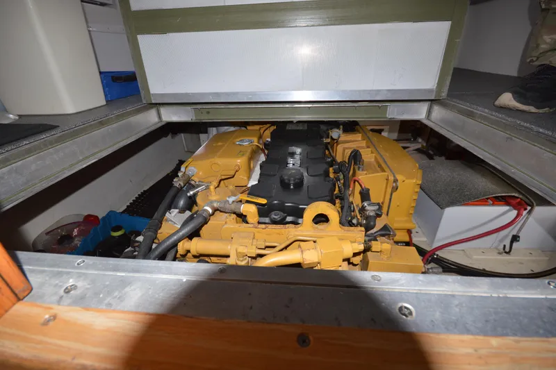 Slide: The Image of Engine compartment of a 2008 Wayne Beal EXPRESS boat, showcasing mechanical components. - 42