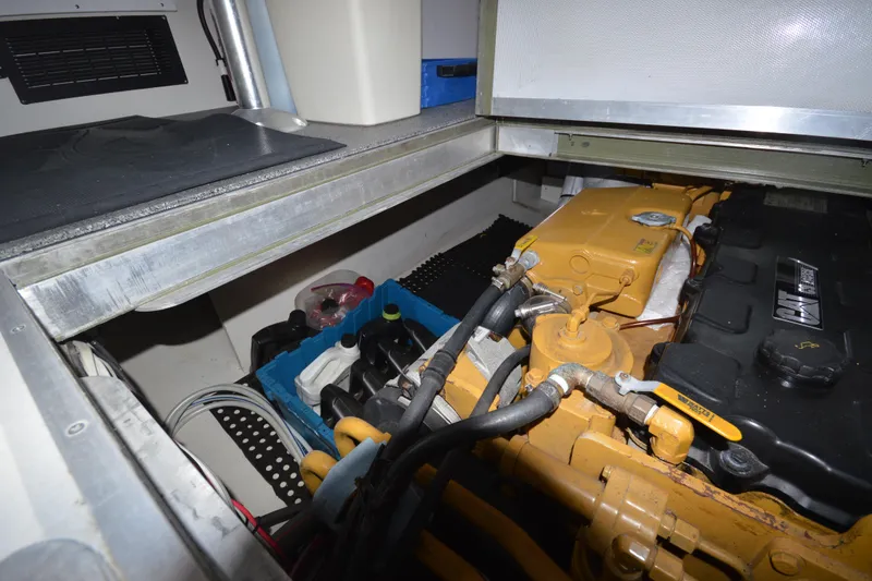 Slide: The Image of Engine compartment of 2008 Wayne Beal EXPRESS boat with visible components and storage. - 44