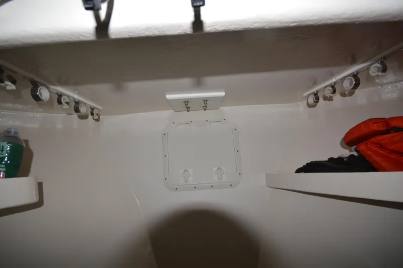 Slide: The Image of Interior cabin of 2008 Wayne Beal EXPRESS boat with shelves and storage hatch. - 45