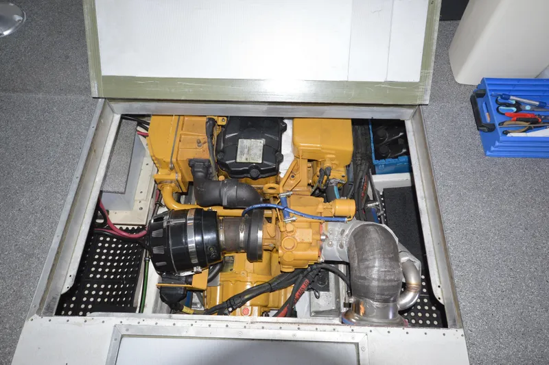 Slide: The Image of Engine compartment of a 2008 Wayne Beal EXPRESS boat, featuring a yellow engine. - 46
