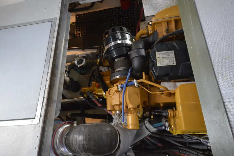 Slide: The Image of Engine compartment of a 2008 Wayne Beal EXPRESS boat, showcasing mechanical components. - 47