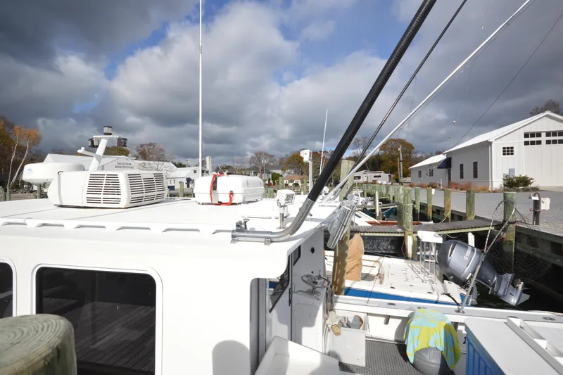 Slide: The Image of 2008 Wayne Beal EXPRESS boat docked at marina under cloudy sky. - 7
