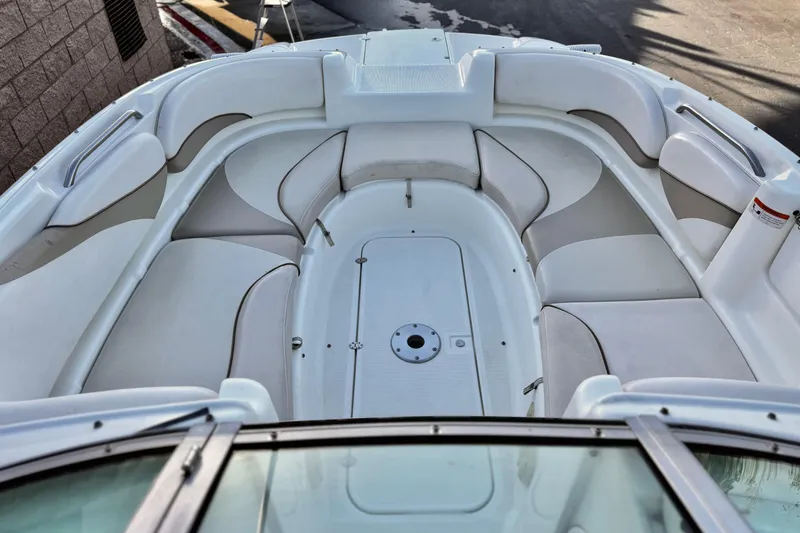 Slide: The Image of 2004 Glastron DX 235 Deckboat interior with spacious seating and sleek design. - 13