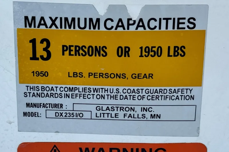 Slide: The Image of 2004 Glastron DX 235 Deckboat capacity label: 13 persons or 1950 lbs, U.S. Coast Guard compliant. - 31