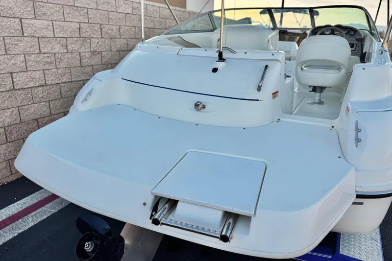 Slide: The Image of 2004 Glastron DX 235 Deckboat with spacious seating and swim platform. - 6