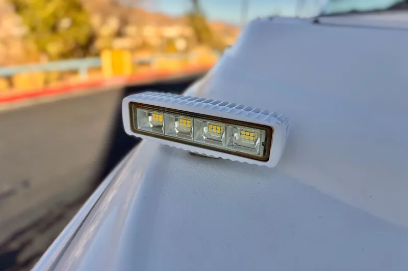 Slide: The Image of Close-up of a 2004 Glastron DX 235 Deckboat LED light fixture. - 9