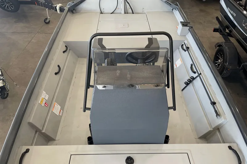 Slide: The Image of 2026 Crestliner 1870 Retriever FCC boat interior with steering console and seating. - 10