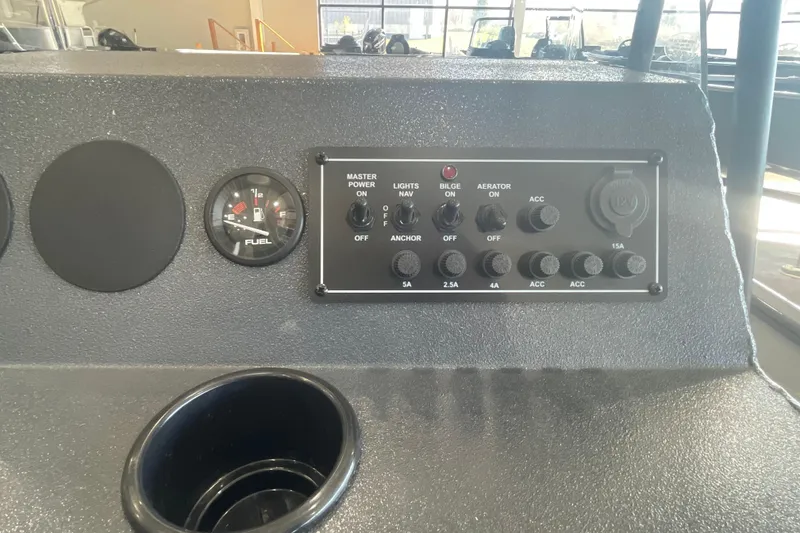 Slide: The Image of 2026 Crestliner 1870 Retriever FCC boat interior with steering console and seating. - 12